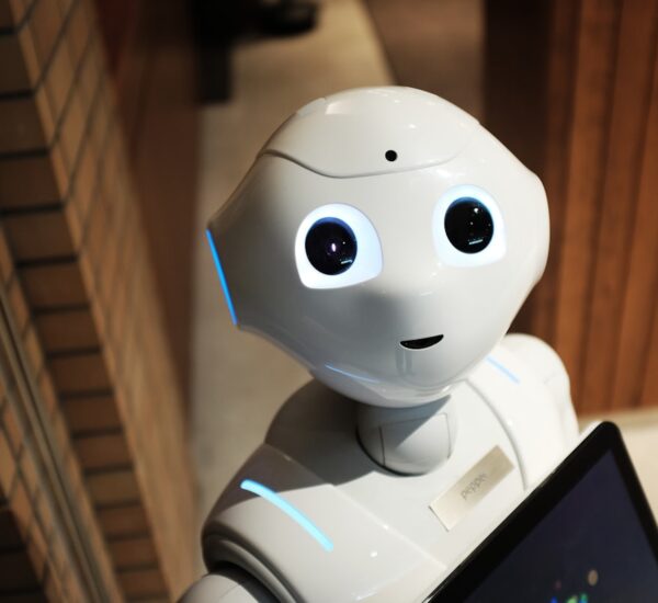 AI robot typing on keyboard simulating human behavior