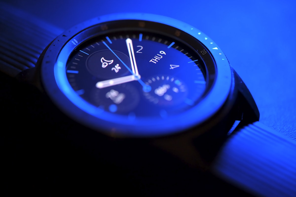 Close-up of a smartwatch health monitoring sensor on a wrist