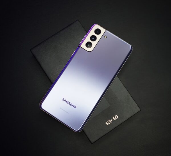 Samsung Galaxy Z Fold 8 unfolded showing large inner display vs Galaxy Z Flip 8 folded compact form factor side by side on a desk