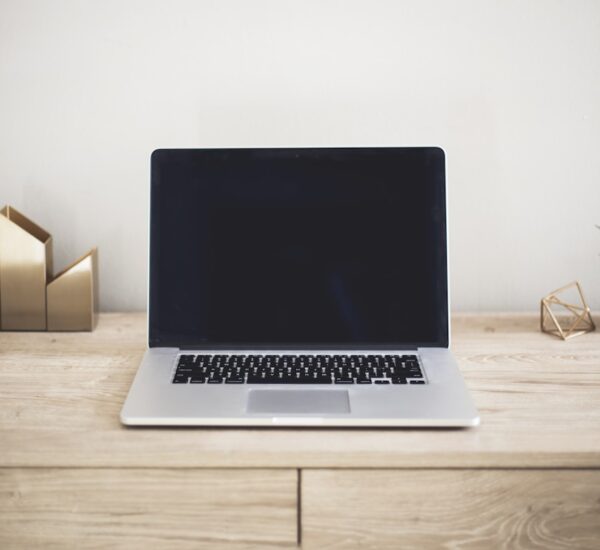 MacBook Pro vs Mac Pro side by side on a modern desk, creative workspace