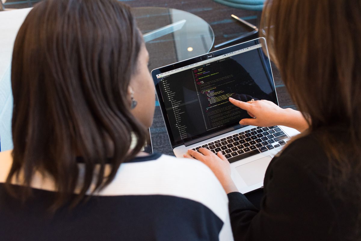 Security analyst reviewing PowerShell output for CVE patch verification