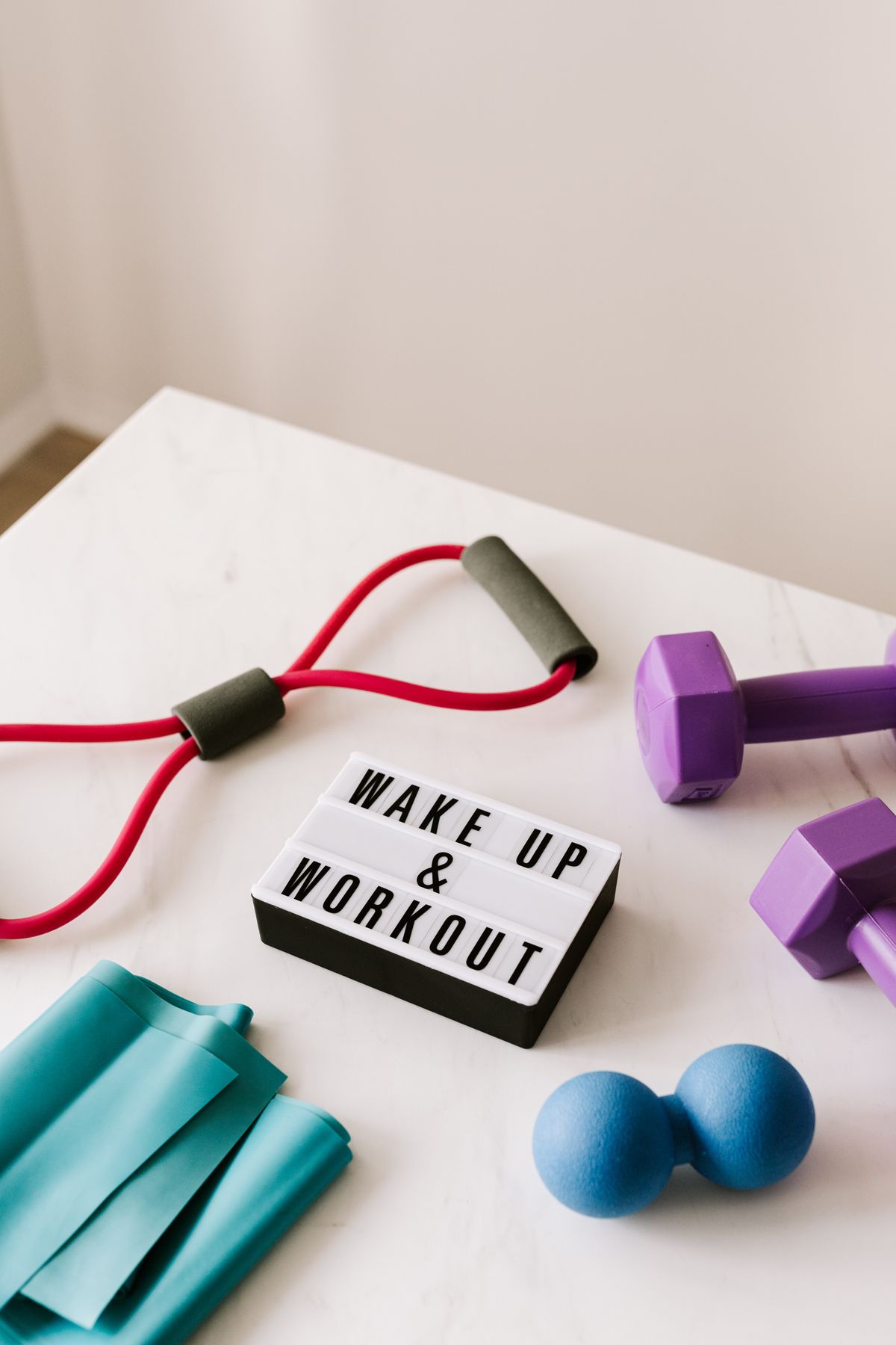 Fitness enthusiast checking heart rate on smartwatch during gym session