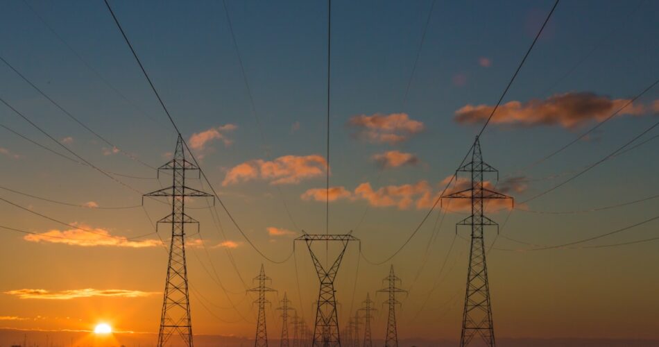 Power transmission towers and electrical grid infrastructure serving AI data centers