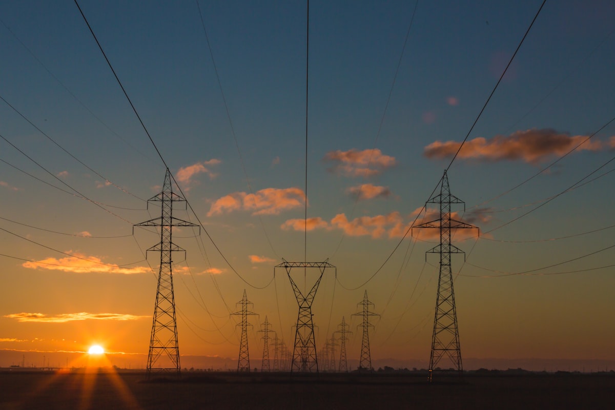 Power transmission towers and electrical grid infrastructure serving AI data centers